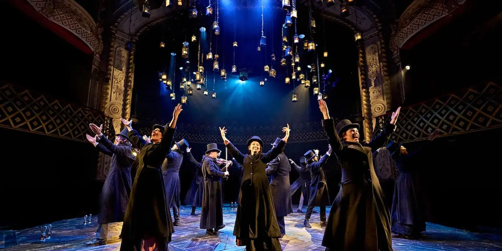 The company beneath the show's signature canopy of lanterns