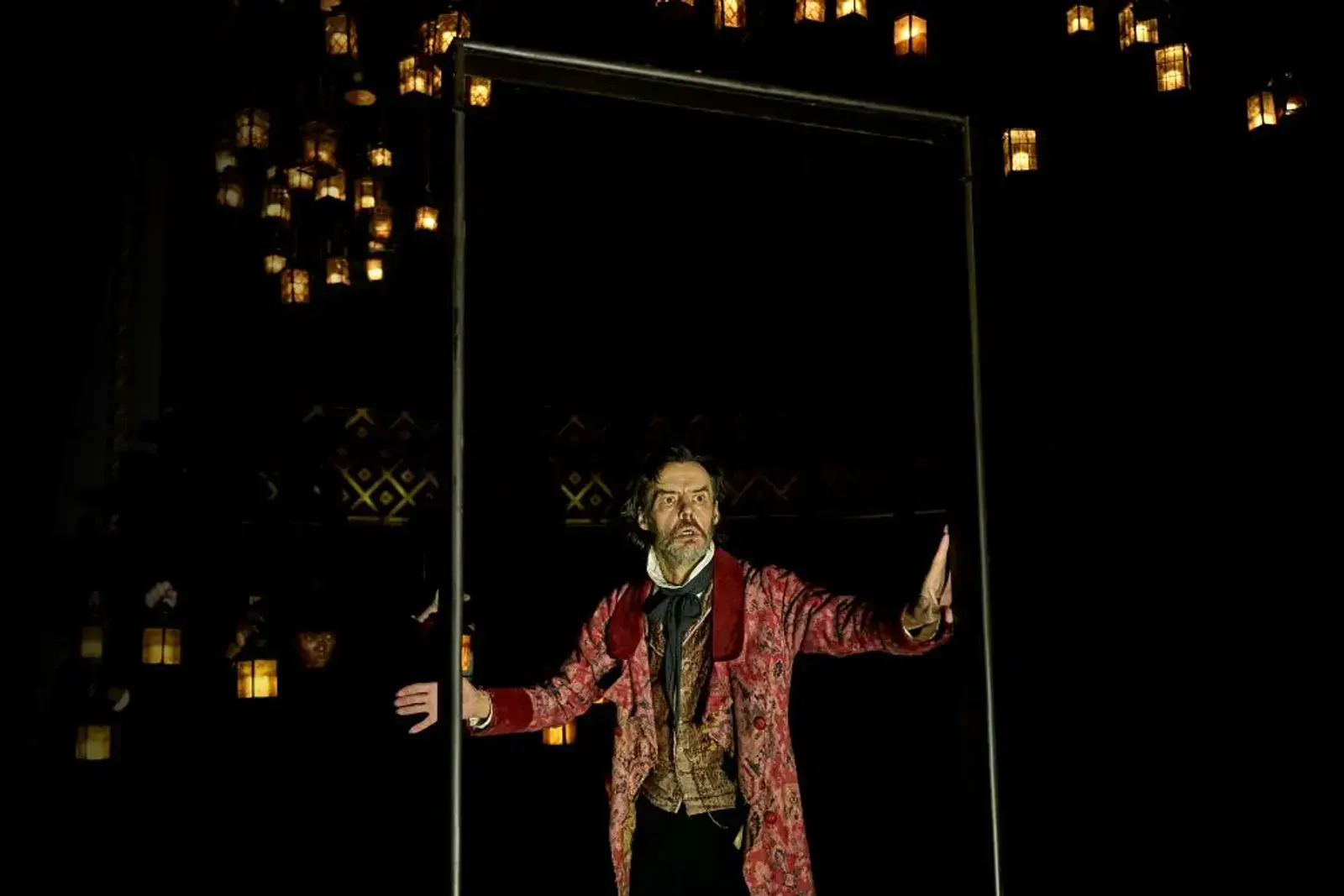 Scrooge amid the hanging lanterns