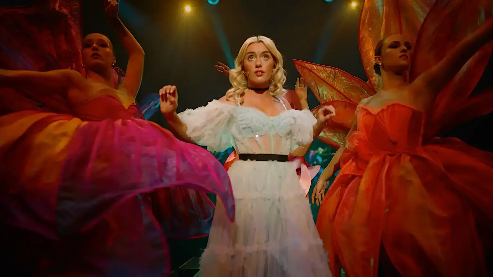 Alice surrounded by the flower-costume ensemble