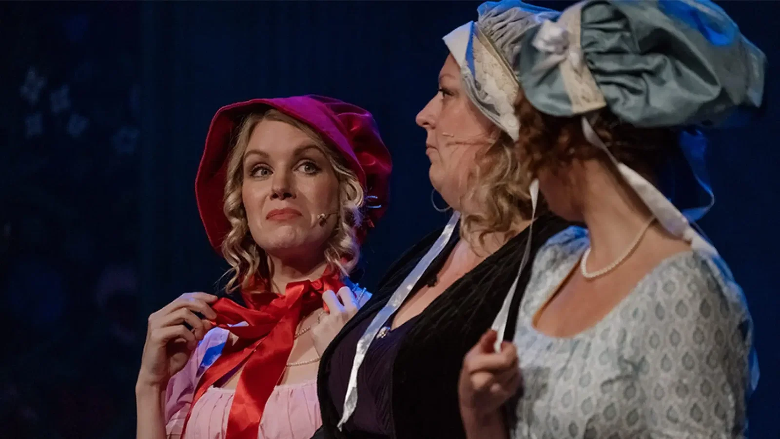 The cast of Austentatious in period costume at the Vaudeville Theatre