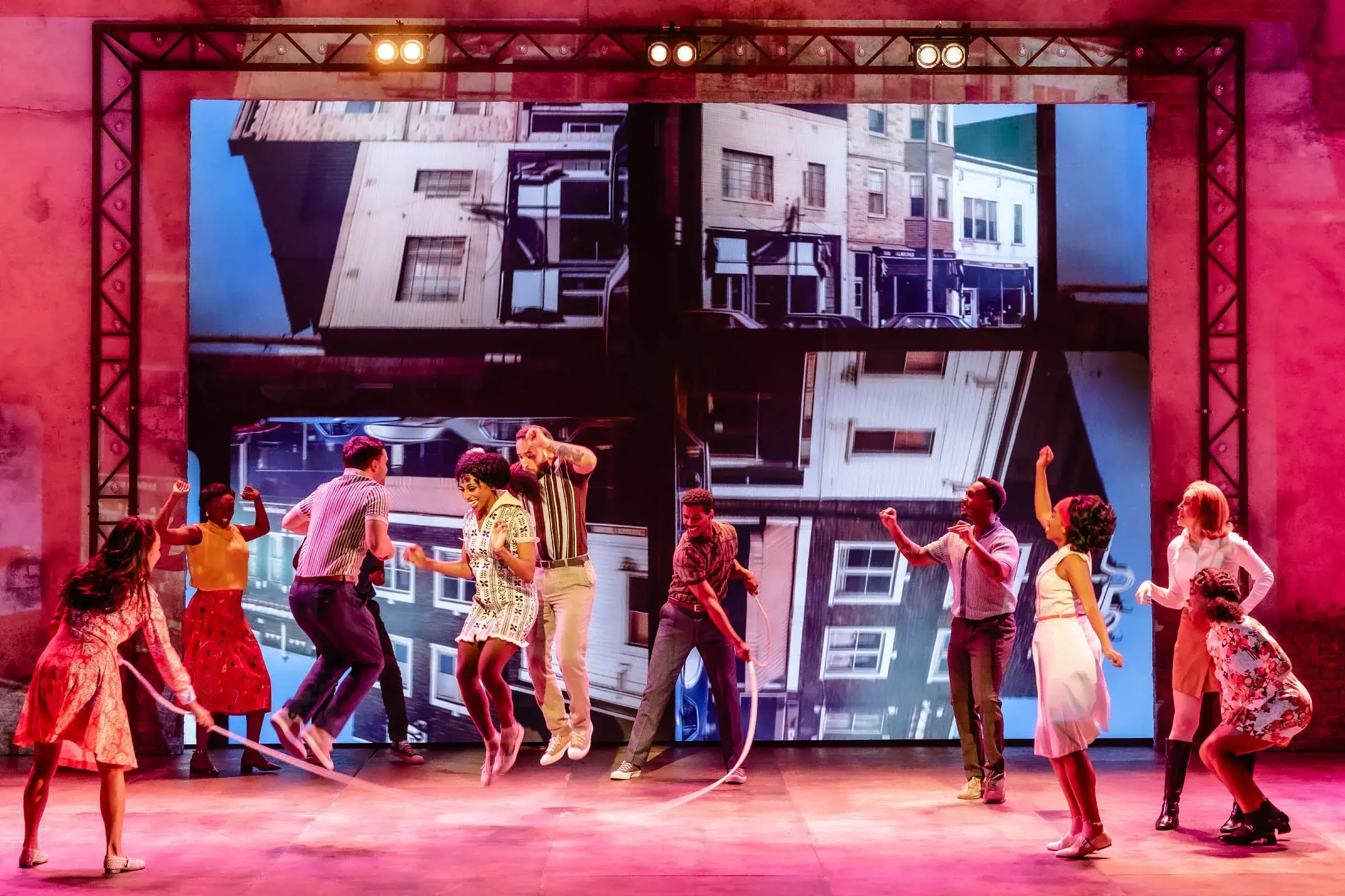 The company in a 1960s street scene in I'm Every Woman – The Chaka Khan Musical at the Troubadour Wembley Park Theatre