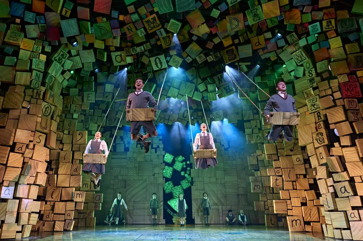 The children swing through the alphabet blocks