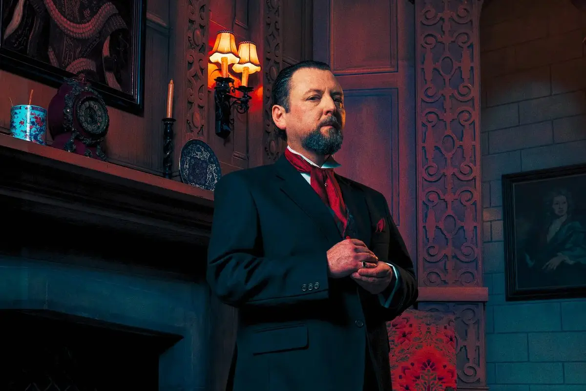 Mr Paravicini by the mantelpiece in The Mousetrap at St Martin's Theatre, London