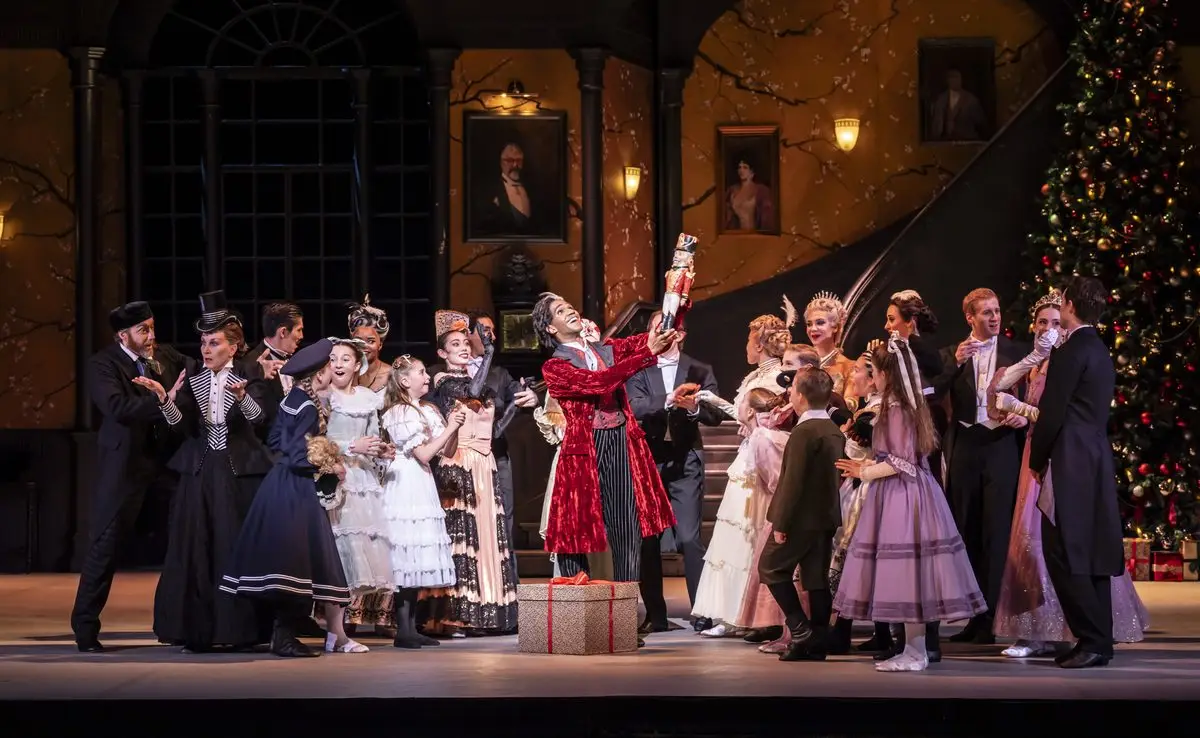 Drosselmeyer at the Christmas Eve party in Nutcracker by English National Ballet at the London Coliseum