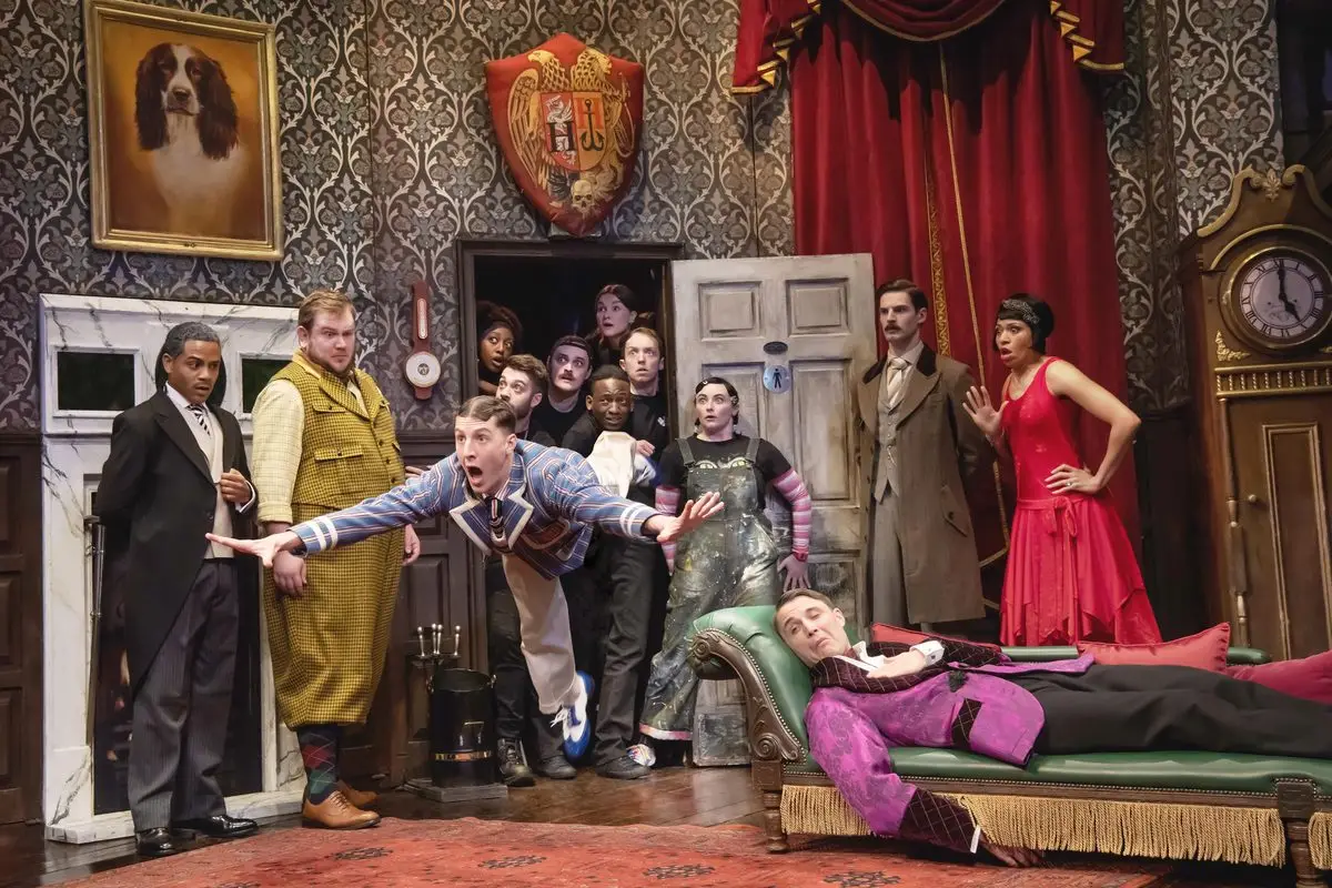 The Cornley company in the doorway