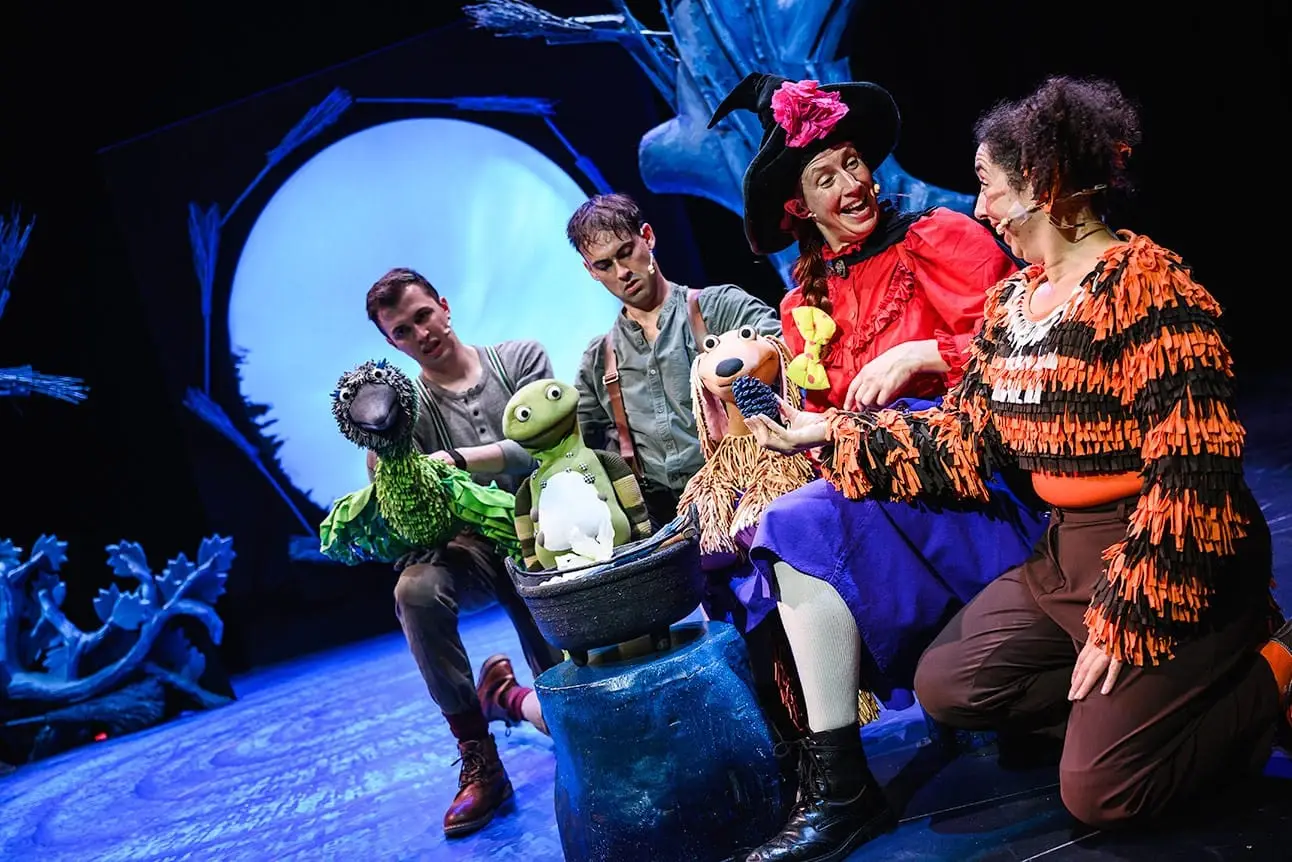 The company gathers around the cauldron