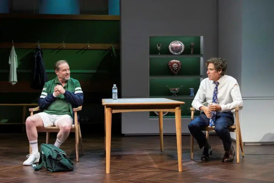 Two men in conversation in a sports changing room in The Truth at the Apollo Theatre