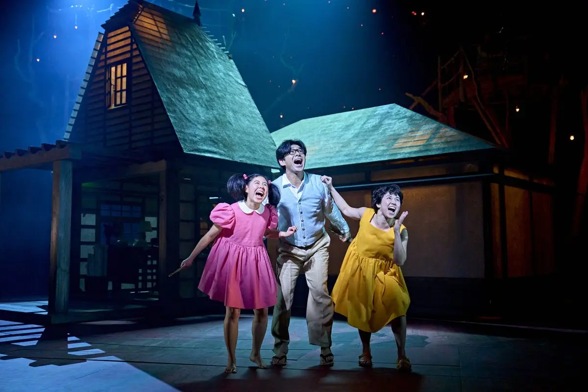 Satsuki, Mei and their father arrive at their new house in My Neighbour Totoro at the Gillian Lynne Theatre, London
